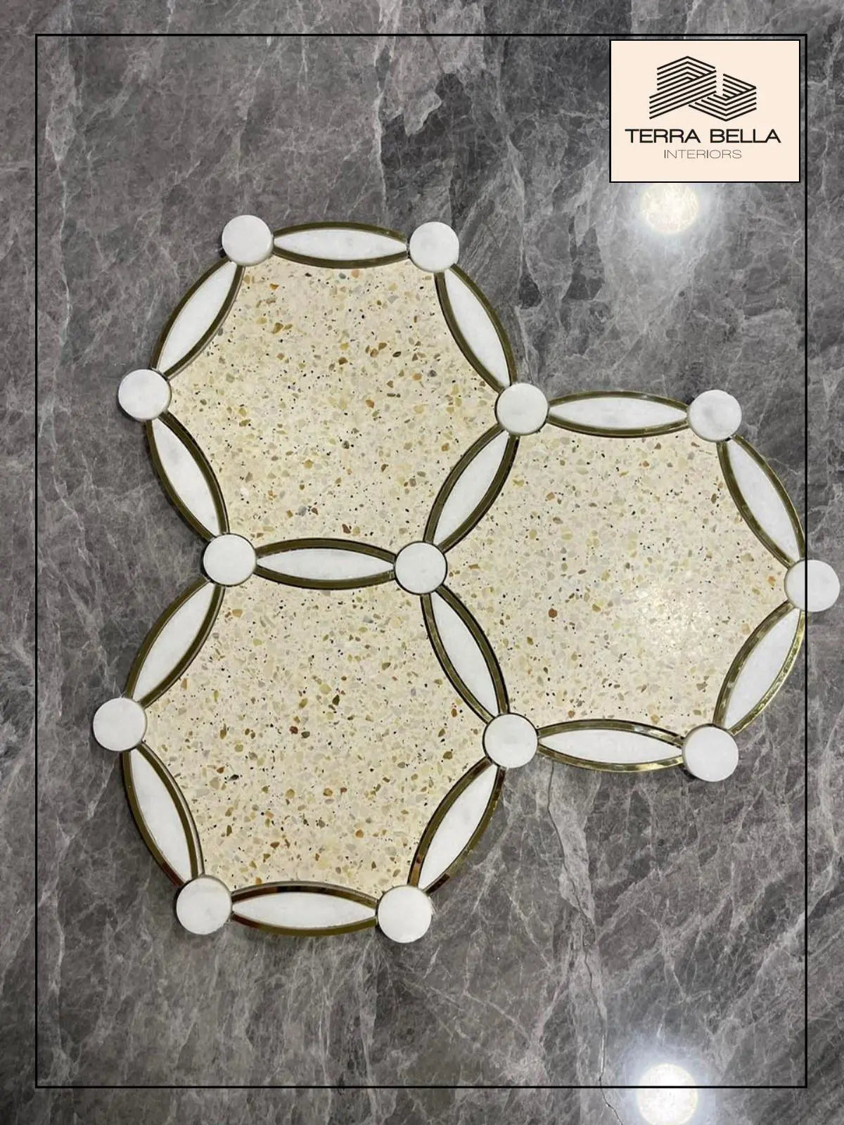 Bespoke circular tile design combining terrazzo and marble with brass accents